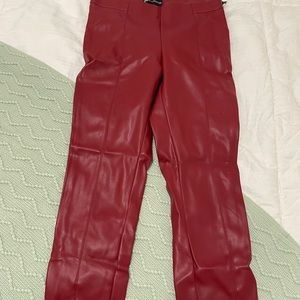 Red leather leggings with a slit